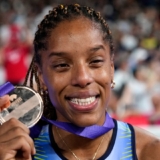 Venezuela's Yulimar Rojas shows her silver medal for the women's triple jump final at the World Athletics Championships in Tokyo, Thursday, Sept. 18, 2025. (AP Photo/Matthias Schrader)
