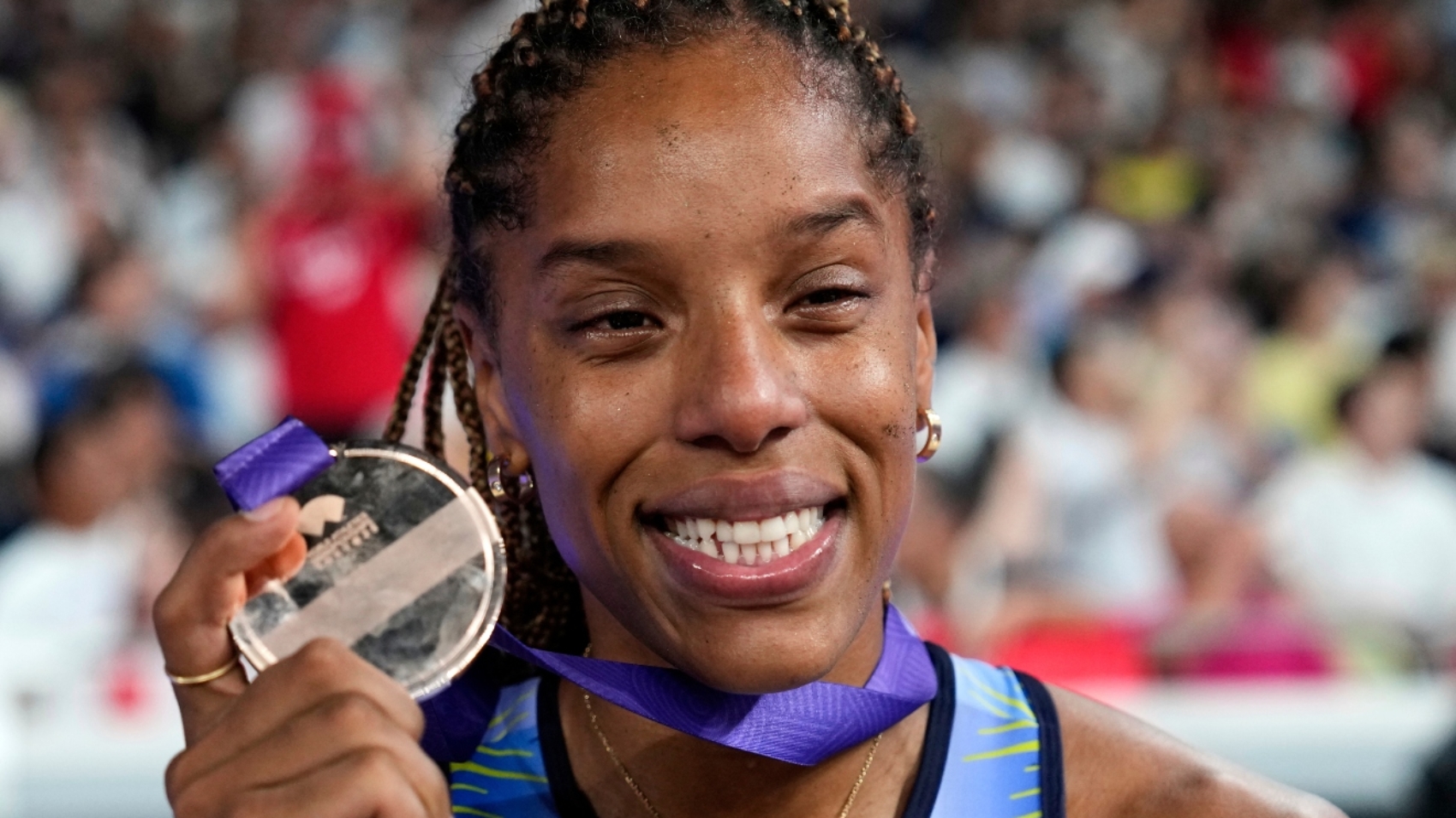 Venezuela's Yulimar Rojas shows her silver medal for the women's triple jump final at the World Athletics Championships in Tokyo, Thursday, Sept. 18, 2025. (AP Photo/Matthias Schrader)