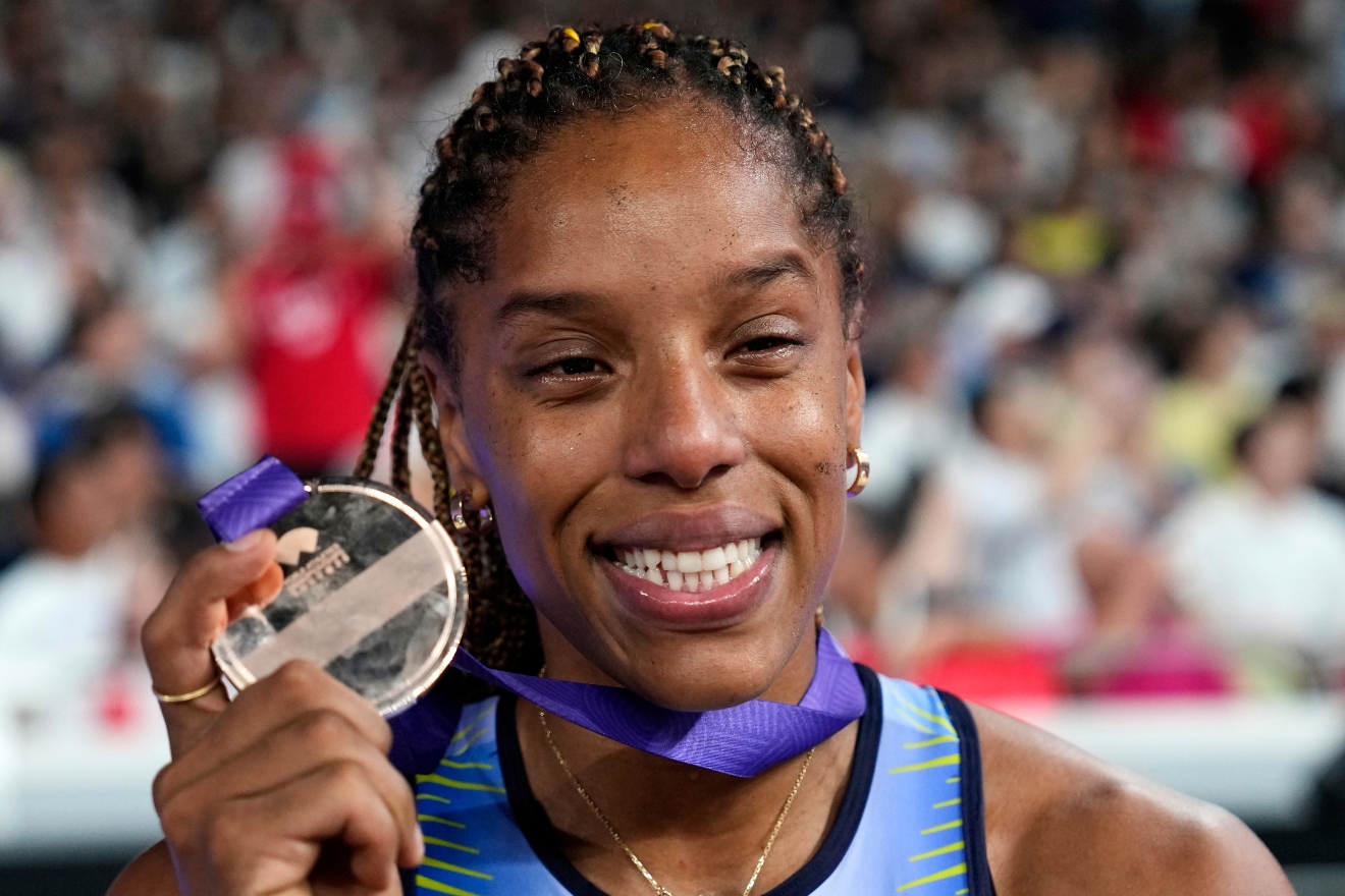 Venezuela's Yulimar Rojas shows her silver medal for the women's triple jump final at the World Athletics Championships in Tokyo, Thursday, Sept. 18, 2025. (AP Photo/Matthias Schrader)
