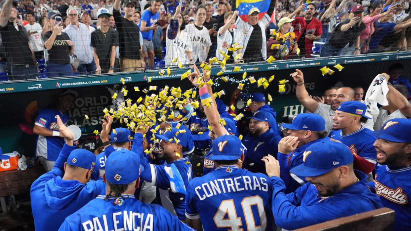 Venezuela team celebrate their victory over Japan after a World Baseball Classic quarterfinal game, Saturday, March 14, 2026, in Miami. (AP Photo/Lynne Sladky)